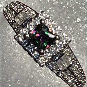 Absolutely gorgeous ring with stunning oil spill and clear crystal stones.